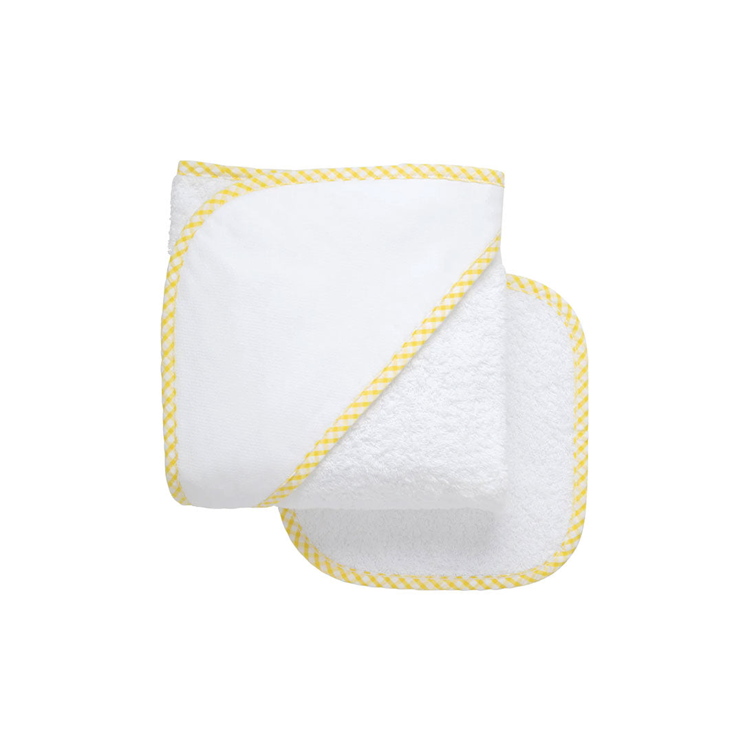 White baby towel and wash cloth with yellow trim on a white background.