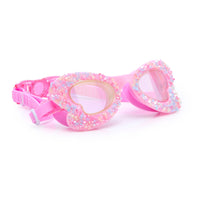 Pink swim goggles with glittery accents on a white background.
