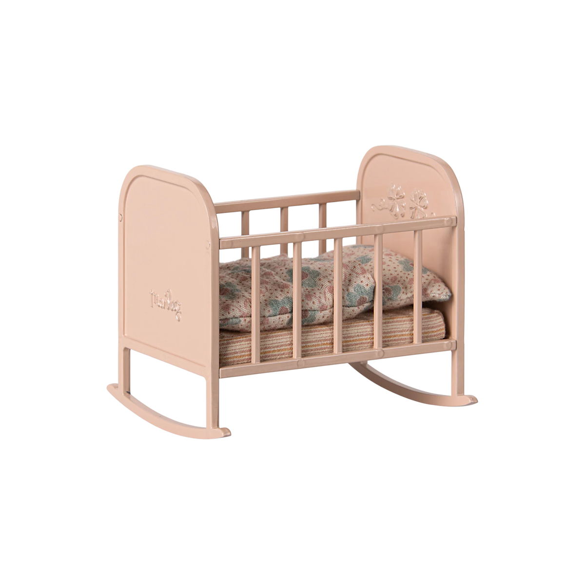 Pink baby crib with a floral-patterned mattress on a white background.
