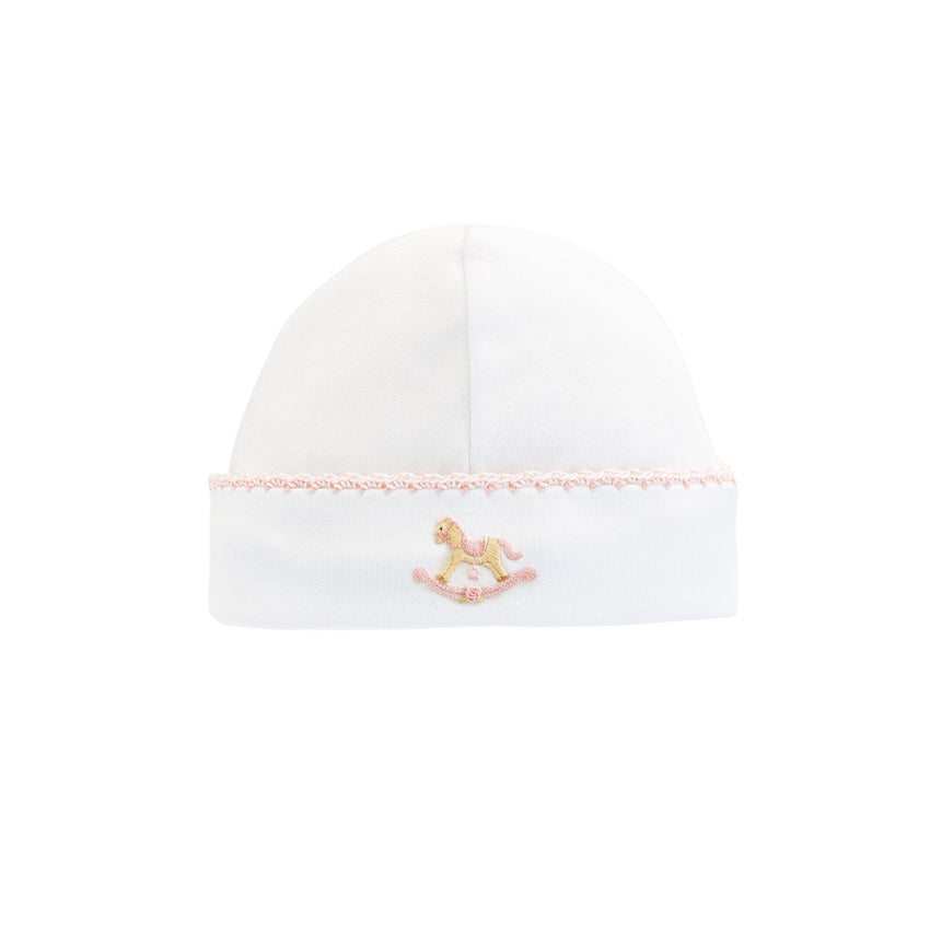 Pink trimmed white baby hat with embroidered rocking horse 
