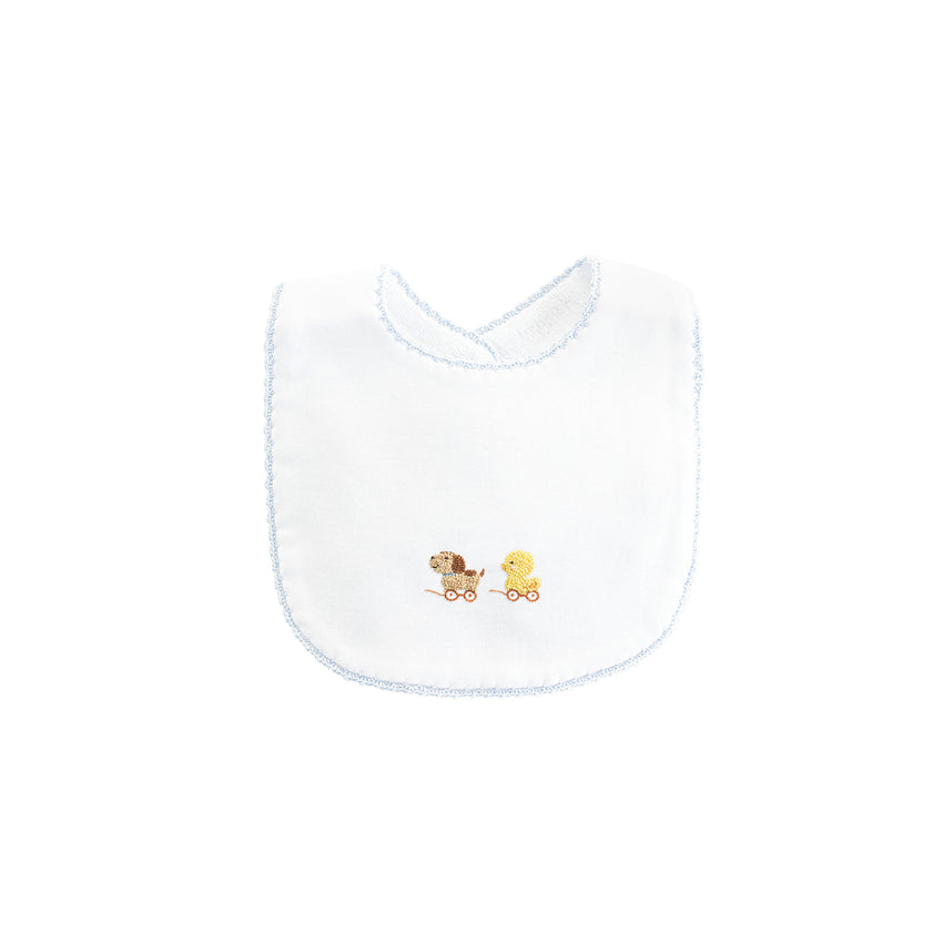 Blue trimmed white bib with embroidered puppy and duck on wheels  