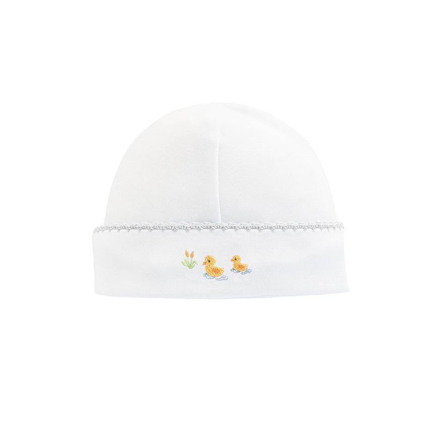 Light grey trimmed white baby cap with an embroidered pair of ducks
