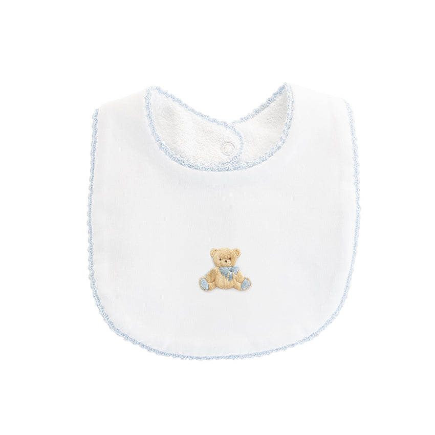 Blue trimmed white bib with teddy bear embroidery