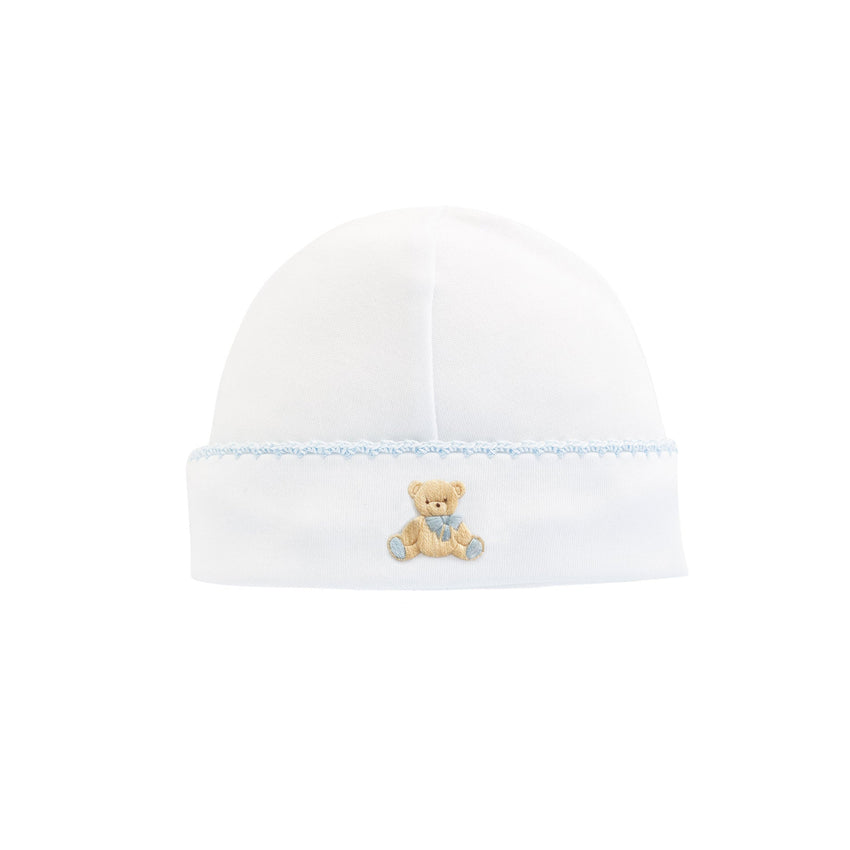 Blue trimmed white baby hat with an embroidered  teddy bear 
