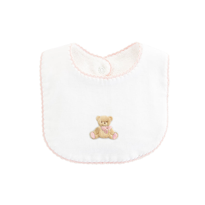 Pink trimmed white bib with embroidered teddy bear.