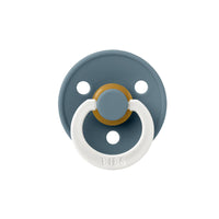 Blue and white pacifier with gold center on a white background