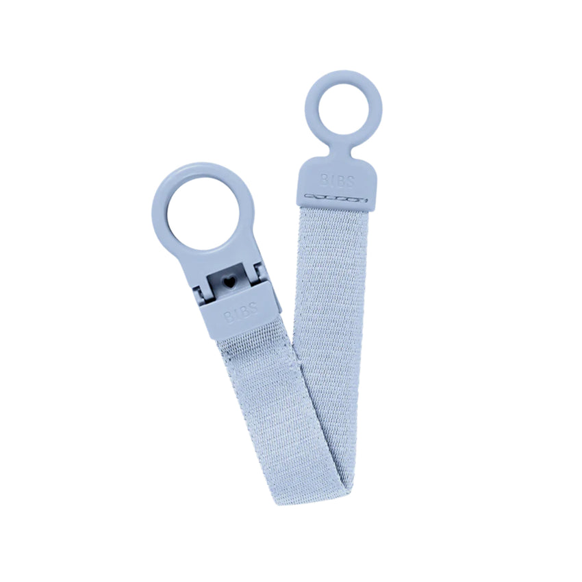 Light blue baby pacifier with a clip on a white background.