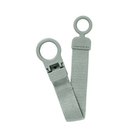 Sage colored pacifier clip on a white background.