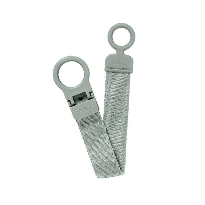 Sage colored pacifier clip on a white background.