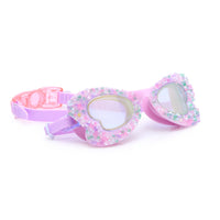 Pink swim goggles with floral design on a white background.