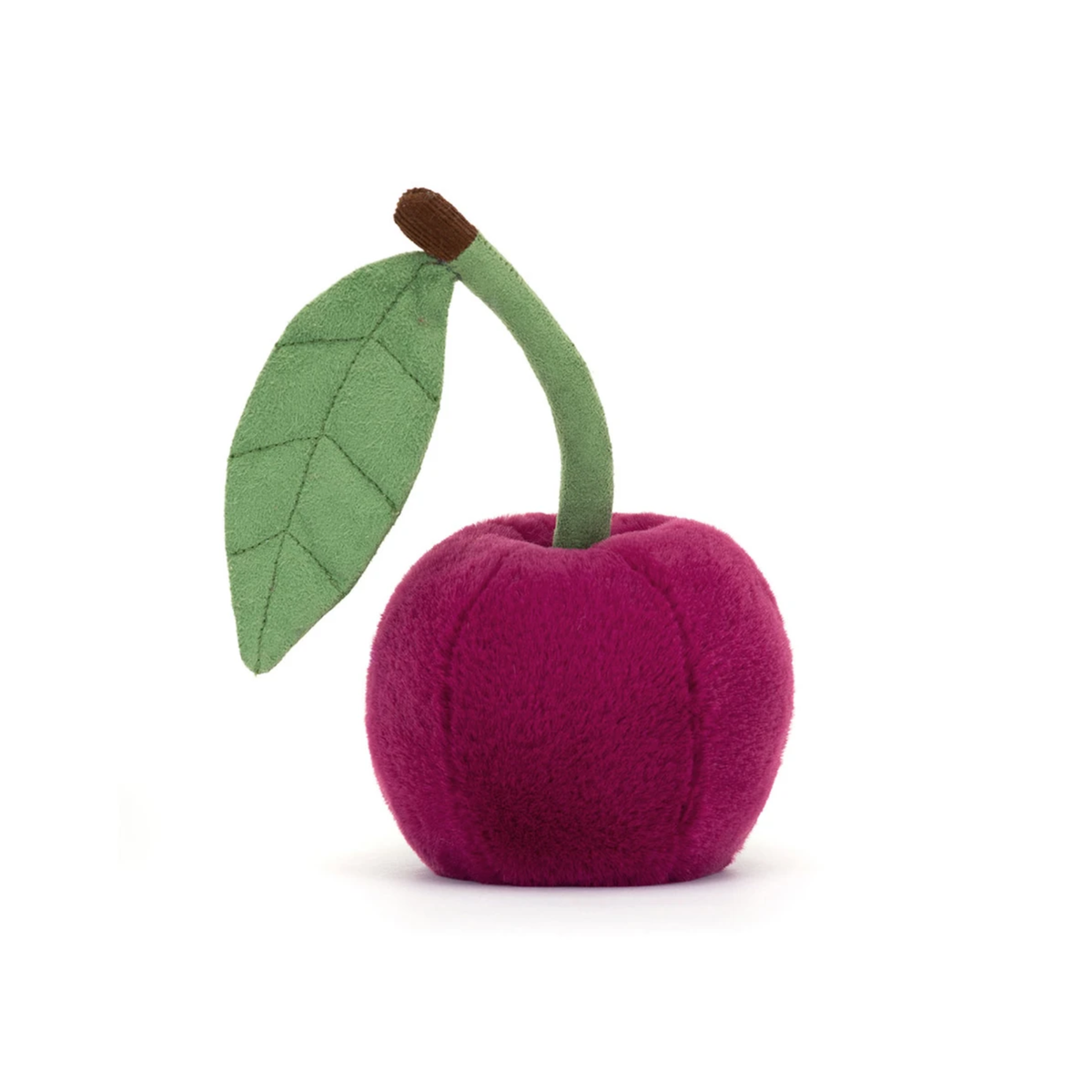 Plush toy cherry with a green leaf on a white background.