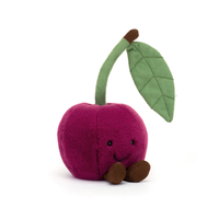 Plush toy cherry with a leaf on a white background.
