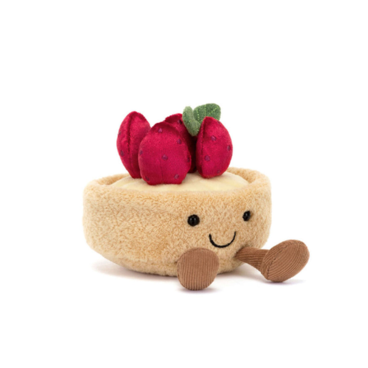A plush strawberry tart toy with a beige fuzzy crust, red fabric strawberries on top, and a smiling face with brown corduroy legs, photographed on a clean white background.