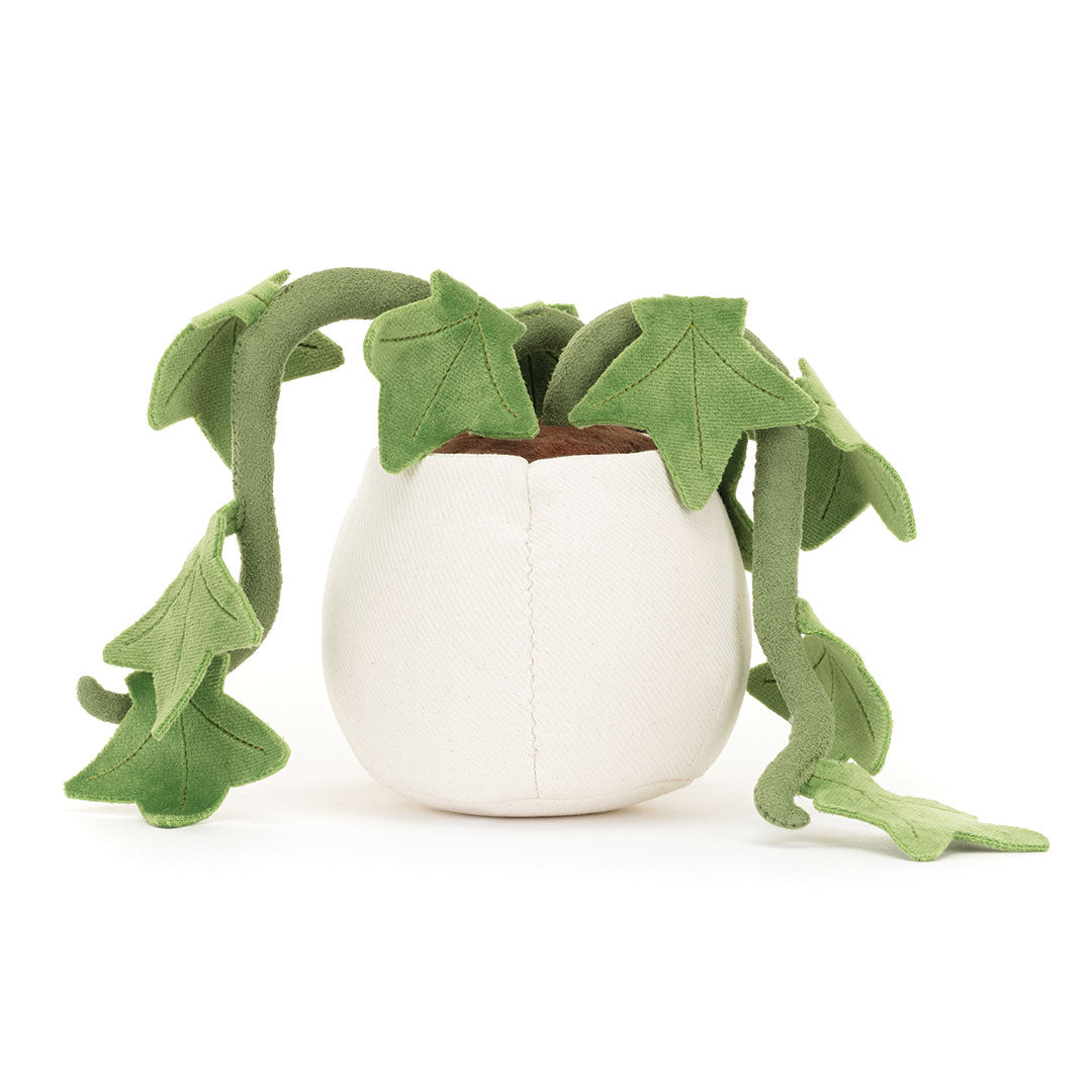 Back view of a plush toy resembling a potted plant with green leaves on a white background.