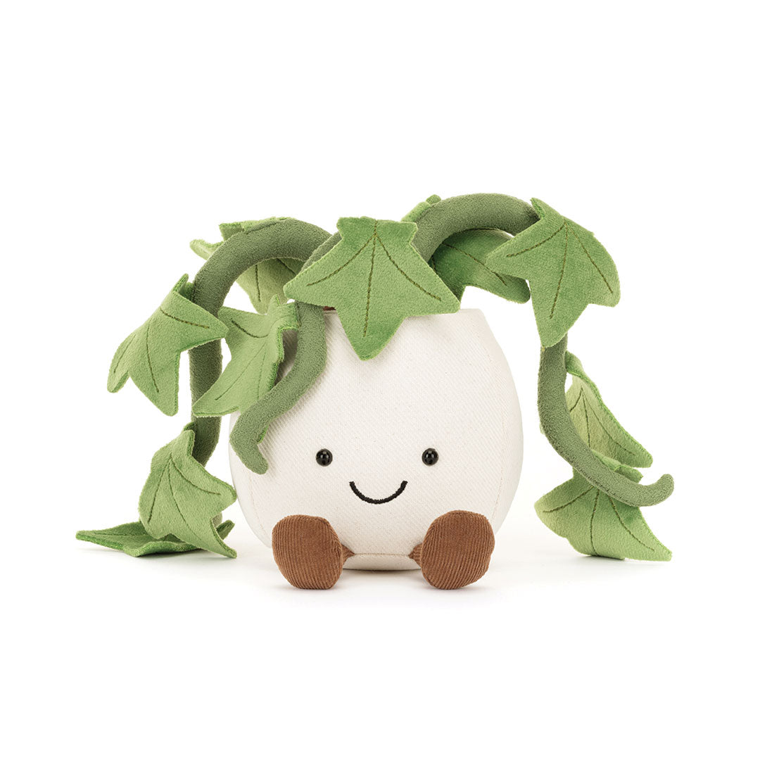 Plush toy with a white face, green leaves, and brown feet on a white background.