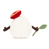 Back of plush toy mozzarella cheese with a tomato slice and piece of basil. 