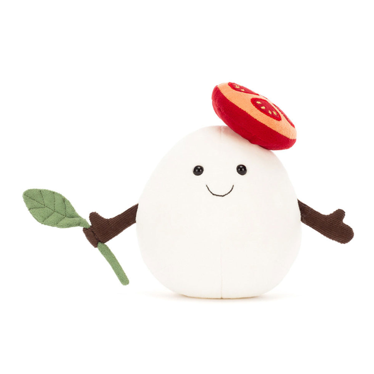 Plush toy mozzarella cheese with a tomato slice and piece of basil. 
 