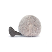 A plush, round, fuzzy gray toy with a short, dark gray feet, photographed on a clean white background.