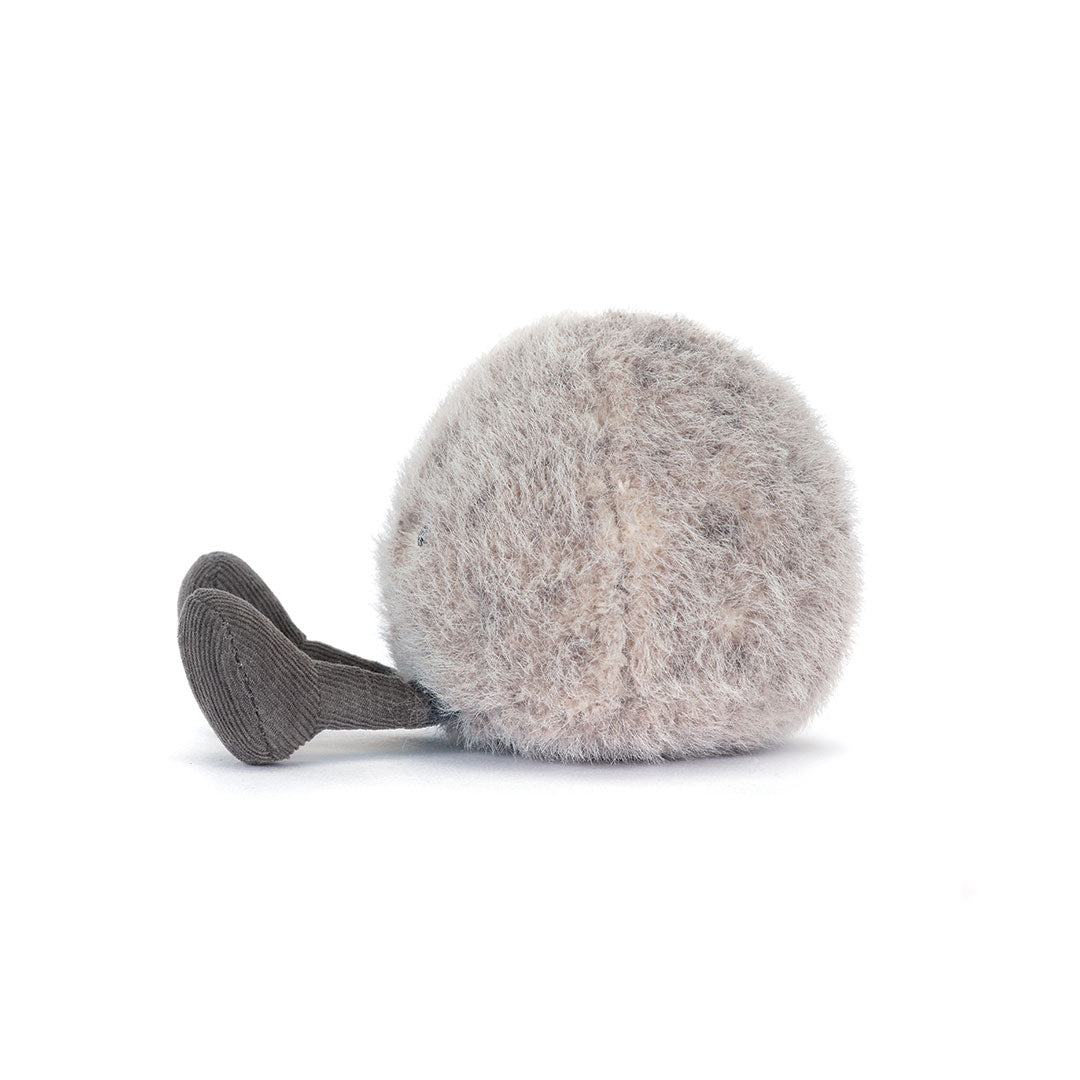A plush, round, fuzzy gray toy with a short, dark gray feet, photographed on a clean white background.