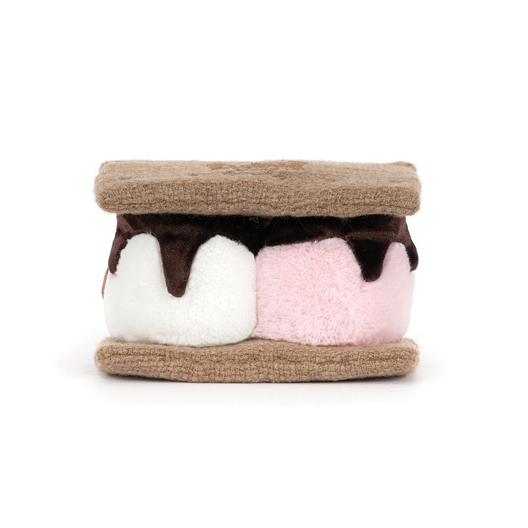 Back view of a  plush s'mores toy of two marshmallows sandwiched between brown textured bottoms, with one marshmallow in white and one in light pink, topped with dark brown chocolate drizzle, on a plain white background.
