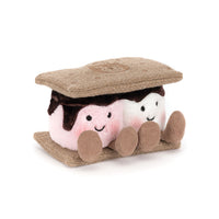 A plush s'mores toy with a white and pink marshmallows and faux-chocolate icing, and tan textured graham cracker tops and sides, shown on a plain white background.