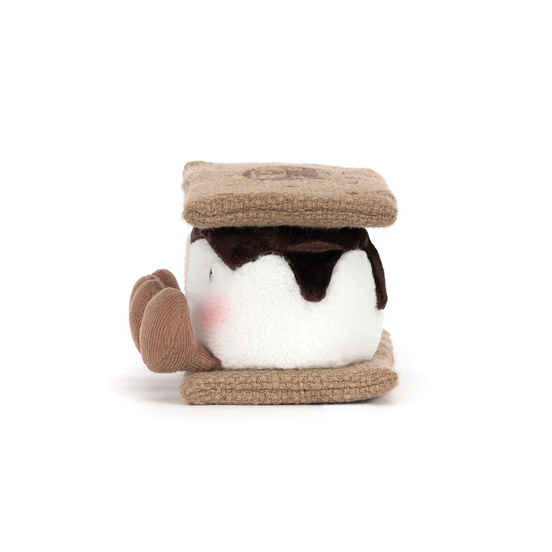 A plush s'mores toy with a white marshmallow and faux-chocolate icing, and tan textured graham cracker tops and sides, shown on a plain white background.