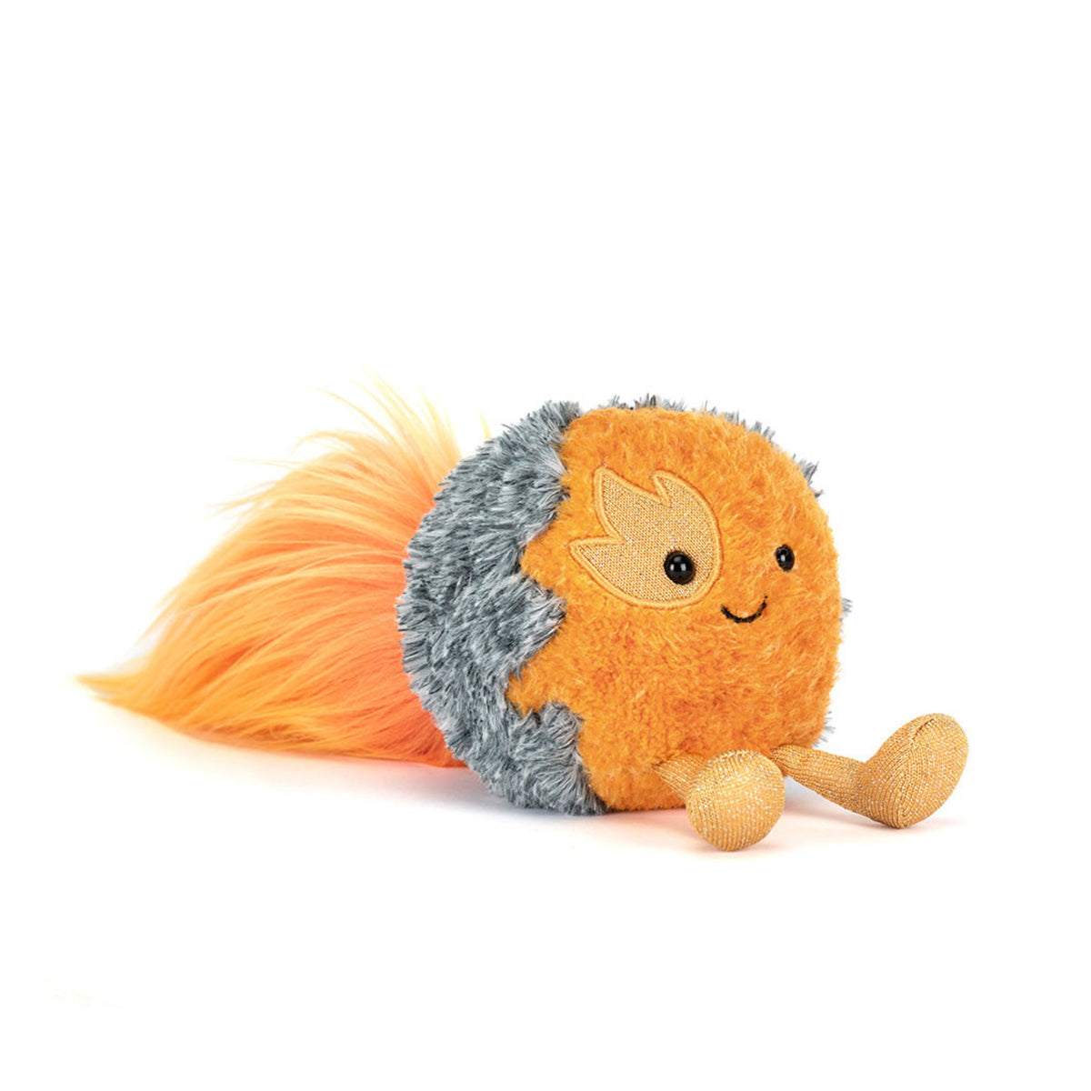 Plush toy representing a flying comet with orange body, long orange streaks of hair and gray spines on a white background.