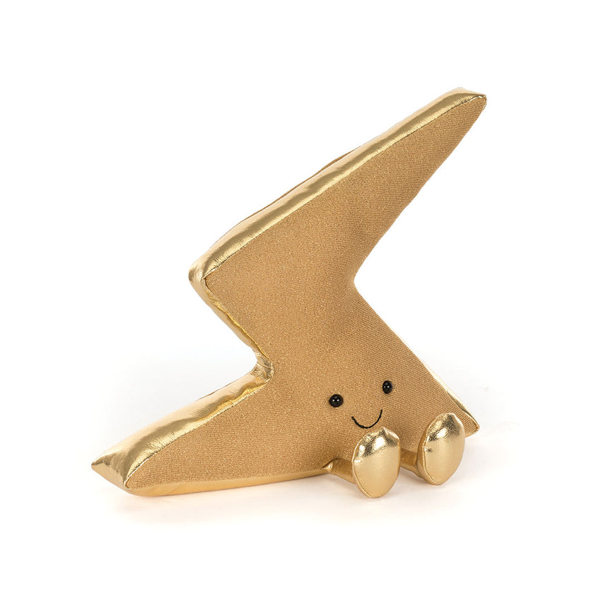 A bolt of lightening stuffed toy shown on a  white background.