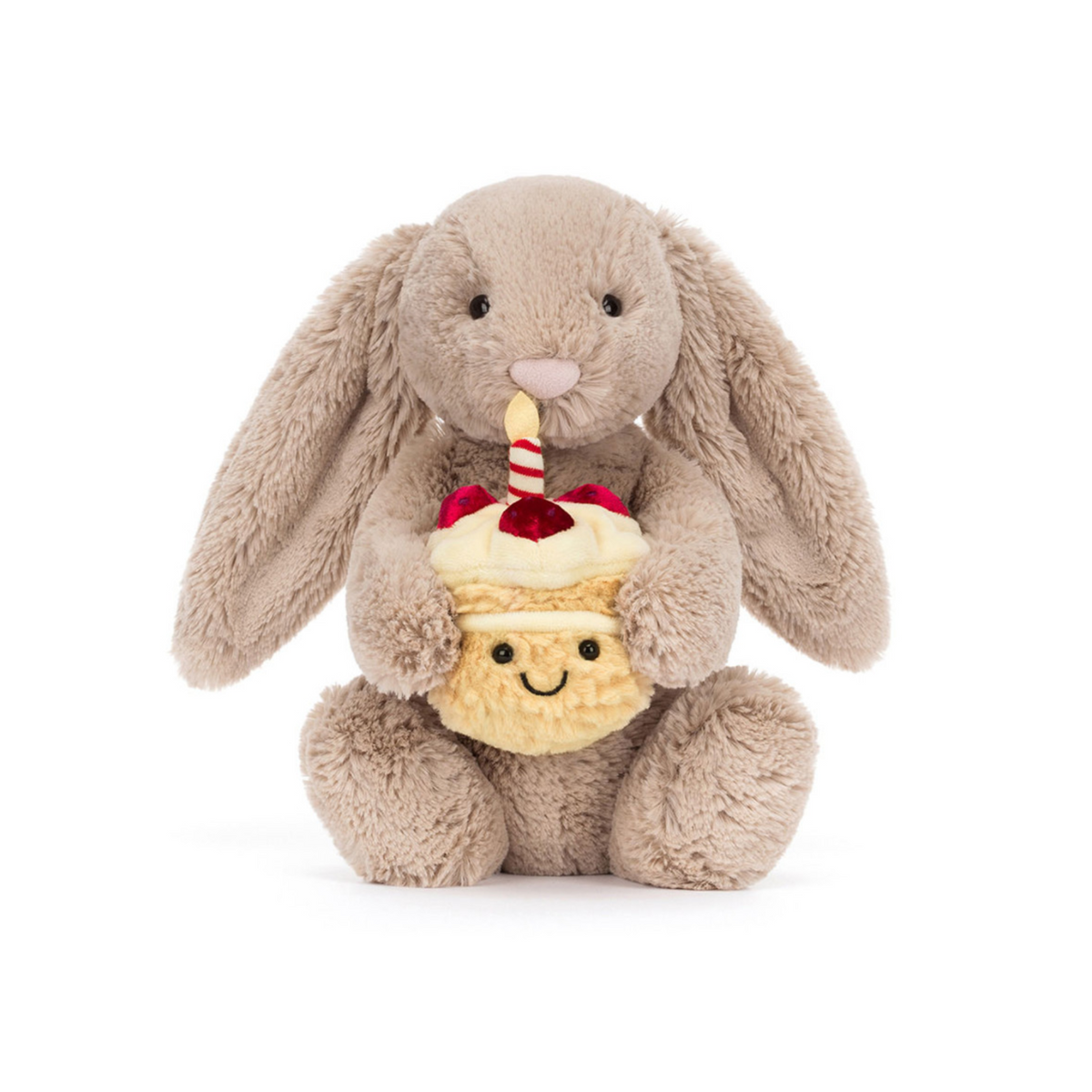 Plush beige bunny holding a cupcake with a candle on a white background.