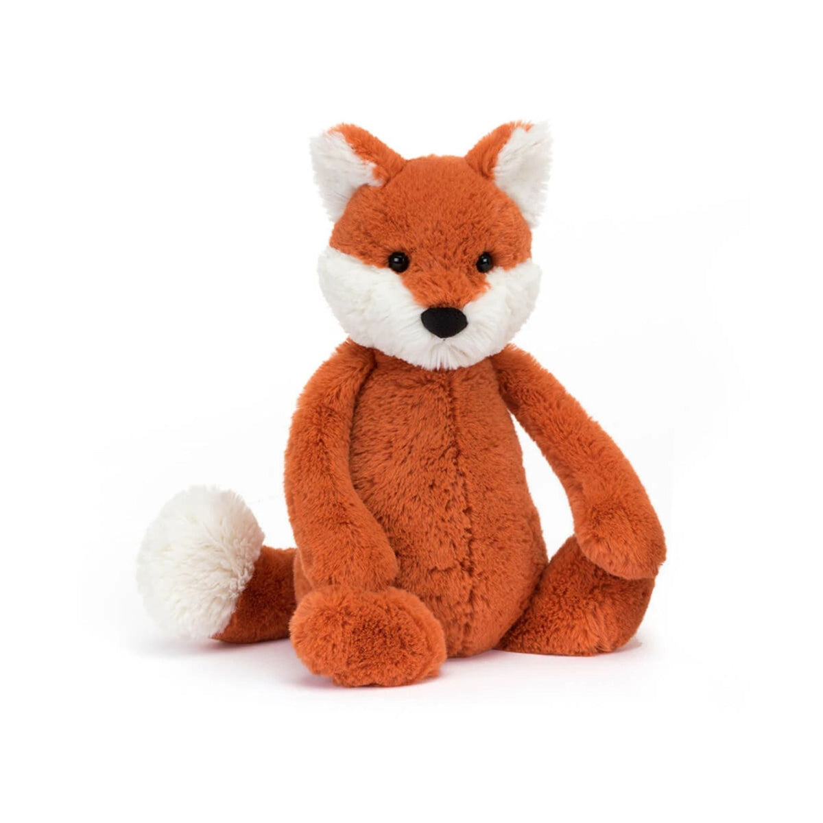 A plush toy fox sitting upright on a clean white background. The toy is made of soft, textured orange-brown plush fabric with a white muzzle, inner ears, and tail tip, and small black embroidered eyes and nose.