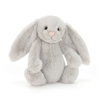 A light silver gray plush bunny toy with long floppy ears, black bead eyes, and a pink stitched nose, sitting against a clean white background.