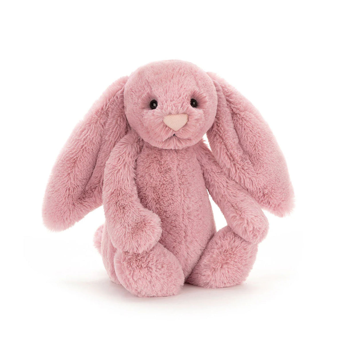 Pink stuffed bunny plush on a white background.