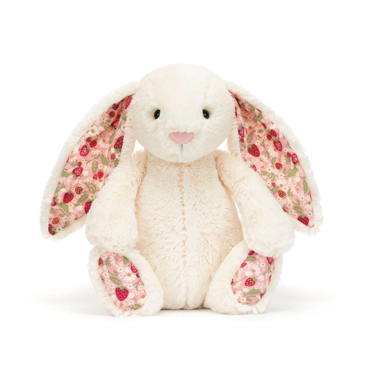 A plush stuffed bunny in off-white with long floppy ears and floral-patterned inner ears, nose, and paw pads, photographed on a clean white background.