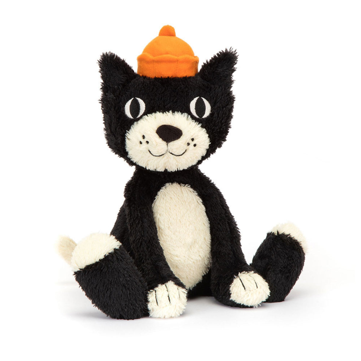 A black and white plush cat stuffed animal wearing an orange hat on a white background.