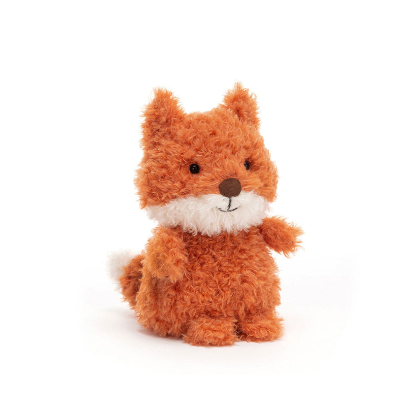 Small orange fox plush toy on a white background.