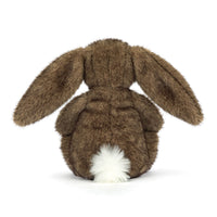Back view of a brown plush bunny toy on a white background.