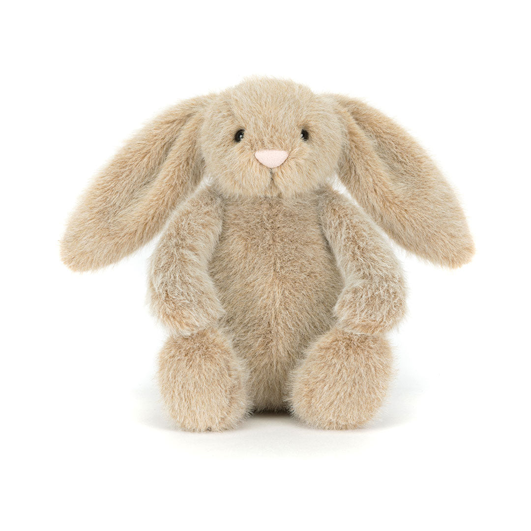 A plush stuffed bunny toy in a light beige or cream color with long floppy ears, small black embroidered eyes, and a tiny pink nose, photographed against a plain white background.