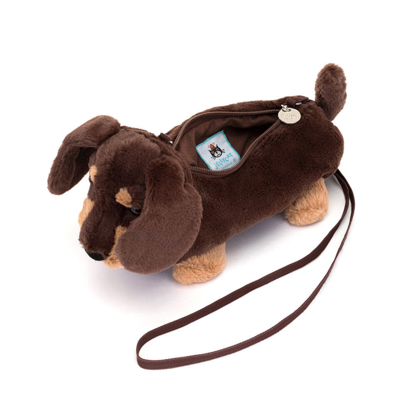 dark brown and tan plush sausage dog shoulder bag on a white background