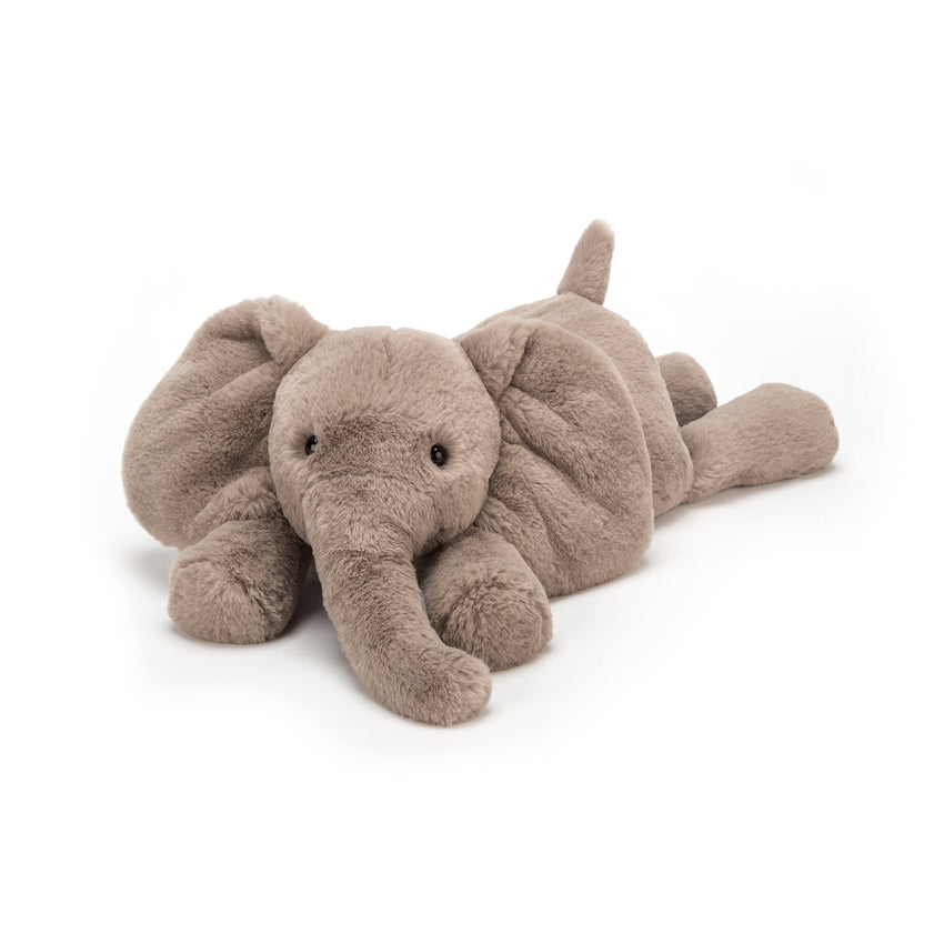 Side view of plush toy  elephant on a white background.