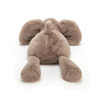 Back view of plush toy elephant on a white background.