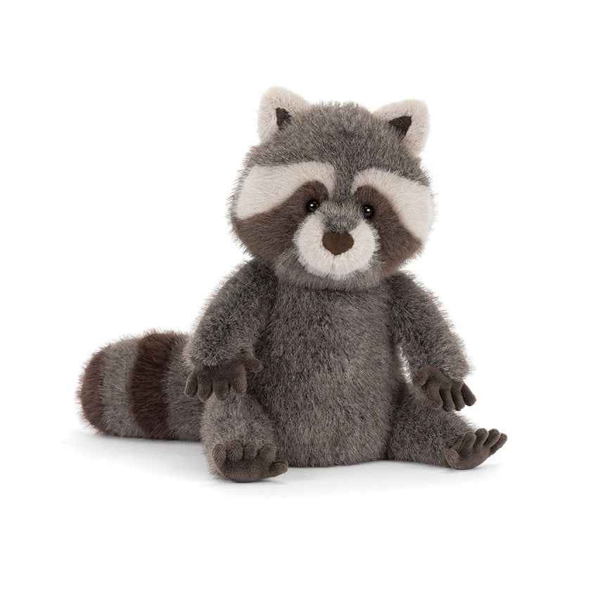 Stuffed raccoon toy on a white background