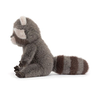 Side view of plush raccoon toy on a white background.