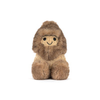 A toy stuffed peanut with a shaggy hat and shoes shown on a white background.