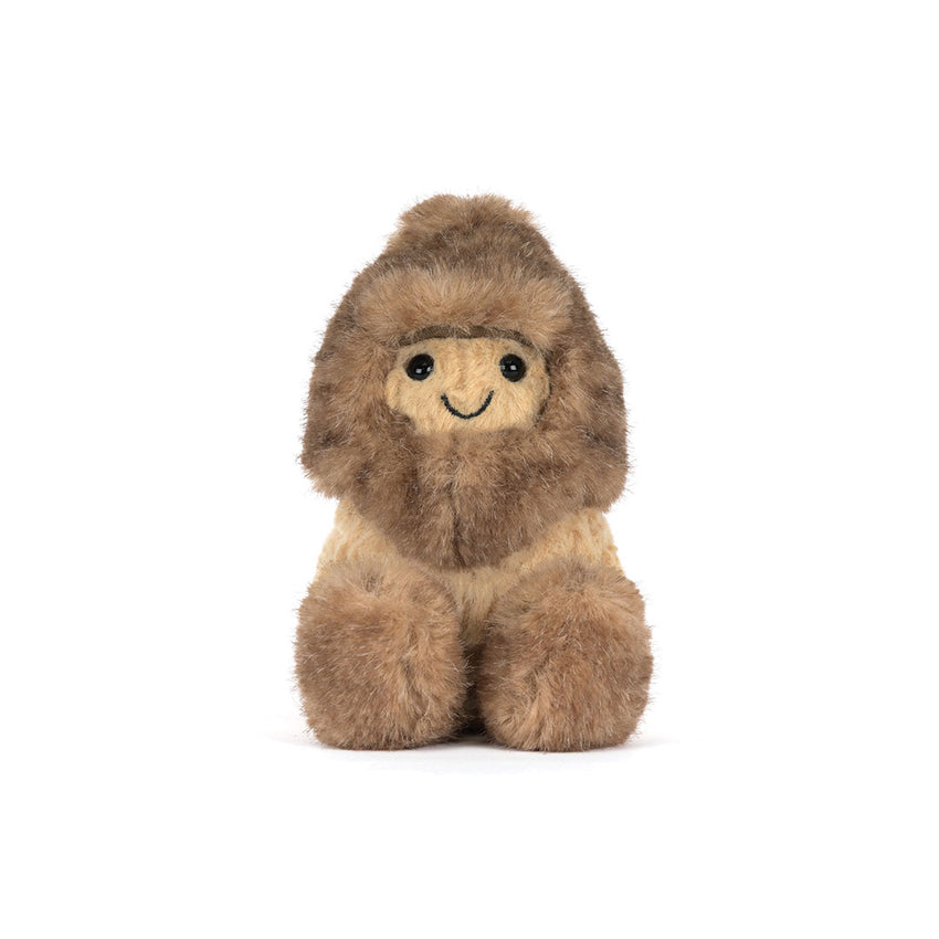 A toy stuffed peanut with a shaggy hat and shoes shown on a white background.
