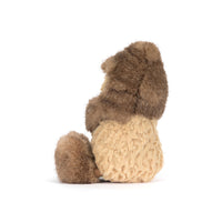 Side view of a stuffed peanut toy with a fuzzy hat and shoes shown on a white background.