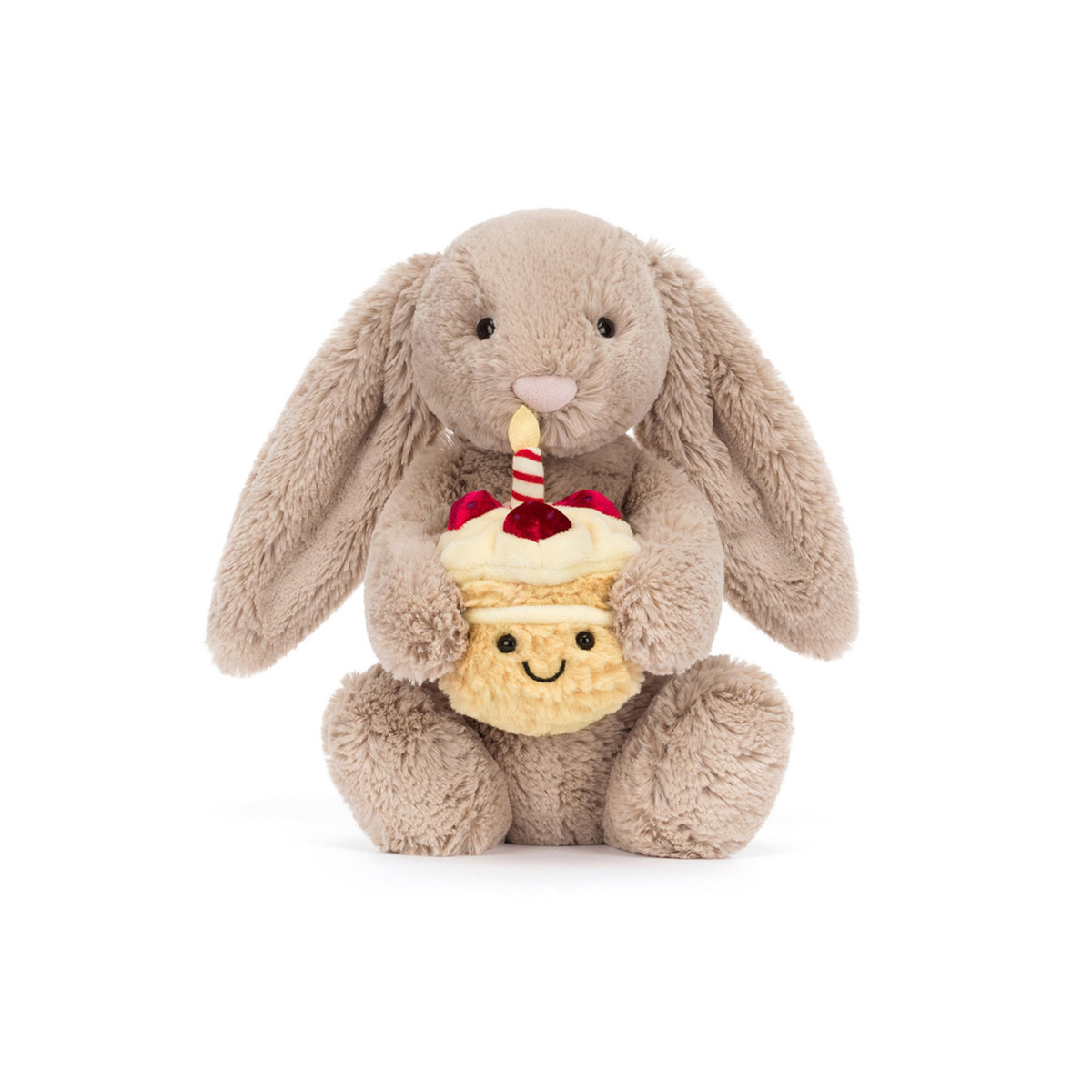 Plush beige bunny holding a cupcake with a candle on a white background.