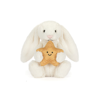 White plush bunny holding a star-shaped cookie with a smiley face on a white background