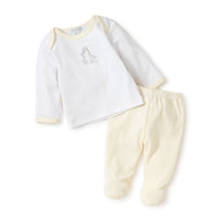 Two-piece long sleeve baby outfit and yellow pants on a white background.