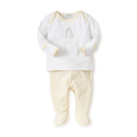 Two-piece long sleeve baby outfit and yellow pants on a white background.