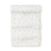 White baby receiving blanket with yellow duck pattern on a white background.